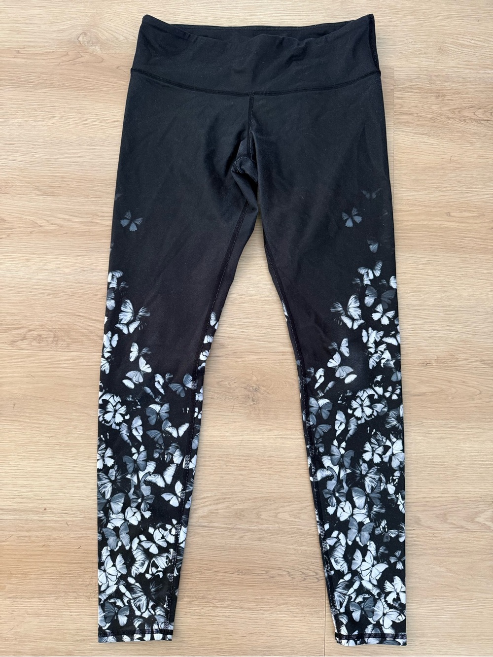 ALO Yoga Women’s Black Leggings with White Butterfly Accent